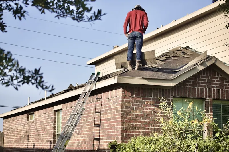 Professional roofer working on a residential roof in La Sierra Hills